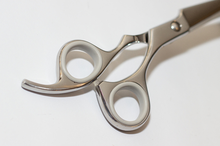 scissors for a hairstyle on white backgroundの写真素材