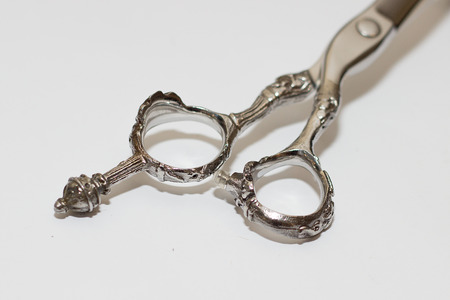 Scissors for a hairstyle on white backgroundの写真素材