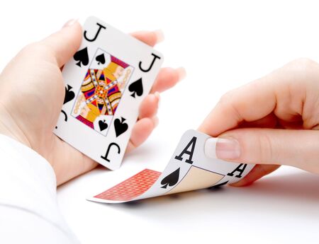 woman hands holding cards with 21 combination - blackjack - focus on the ace being drawnのeditorial素材