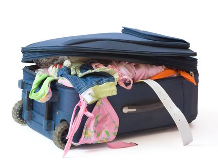 Suitcase full with summer clothes ready for the summer holidaysの写真素材