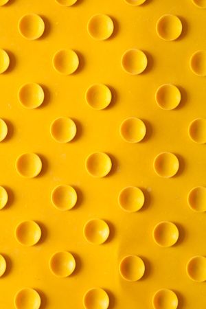 Texture of a yellow rubber rug with suckersの写真素材