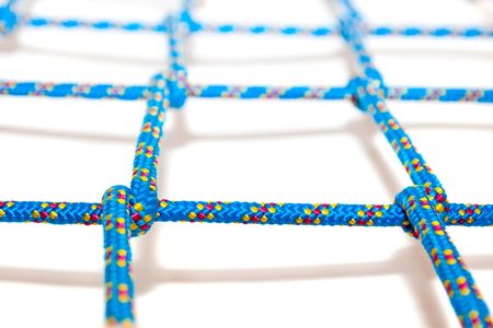 Blue net with shallow focus, on white backgroundの写真素材