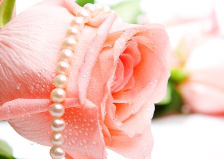 Pink rosebud and pearlsの写真素材