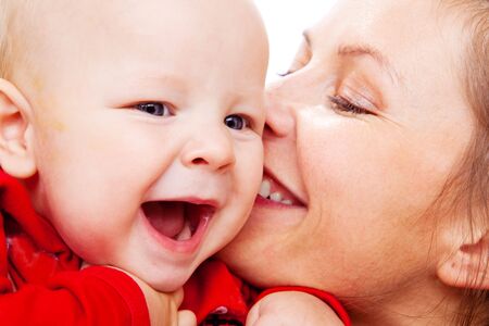 Mother kissing her dear baby