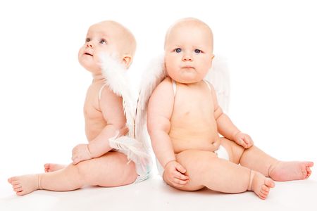 Two angelic baby friends in white diapersの写真素材