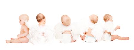 Group of five baby angels sitting, rear view, isolatedの写真素材