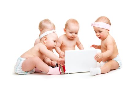 Curious babies group  working at laptop, isolatedの写真素材