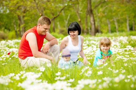 Beautiful happy family having fun on the meadowの写真素材