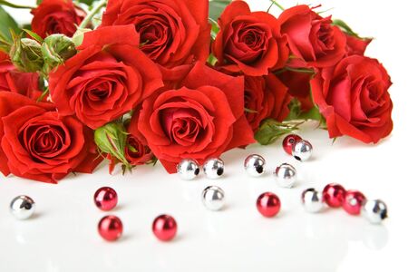 Red roses bouquet and beads on white backgroundの写真素材