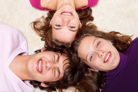 Portrait of three teens laughing
