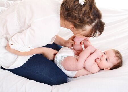 Mother kissing her lovely baby