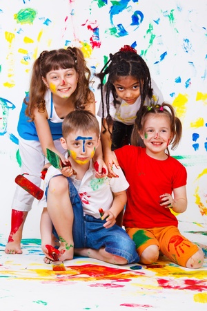 Painting activity keeping four kids busyの写真素材