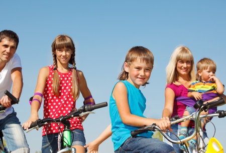 Portrait of family on  bicyclesの写真素材