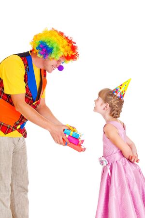 Cheerful clown giving little girl her birthday presentsの写真素材