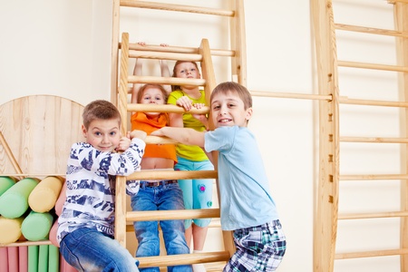 Elementary school students playing in gymの写真素材
