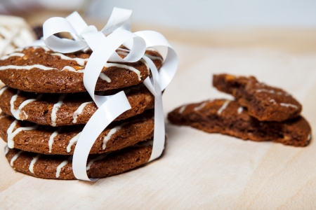 Crunchy chocolate cookies tied with white ribbonの写真素材