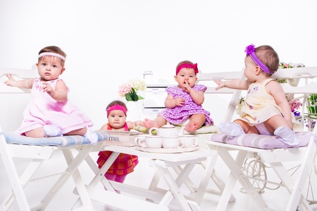Adorable babies group having tea partyの写真素材