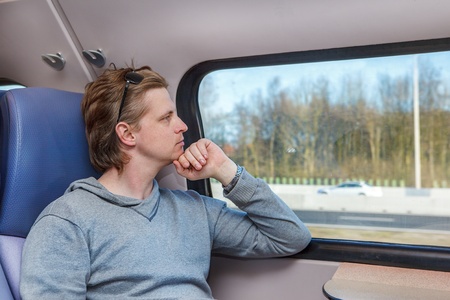 Portrait of a man in a train carriage