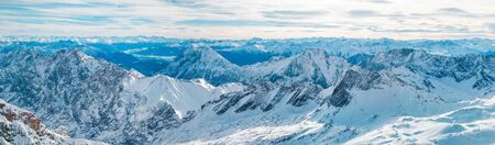 Panorama of the Alps peaks covered with snow in winterの写真素材