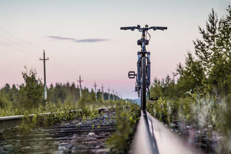 bicycle by the train railways.の写真素材