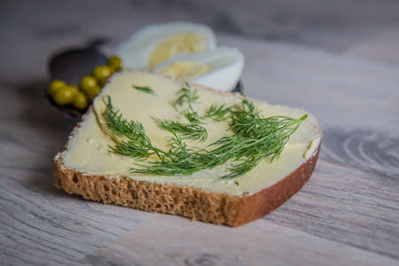Breakfast. Egg and peas on a plate wiht breadの写真素材