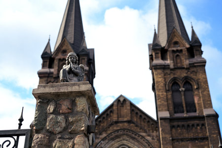 Praying Angel Statue in Front of St. Nicholas Church in Kamianske, Ukraineの写真素材