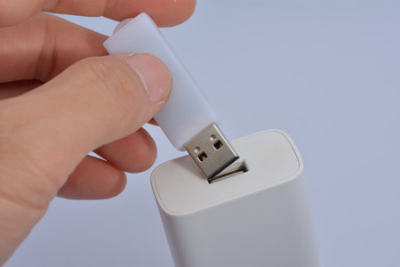 thumbdrive in  hand white backgroundの写真素材