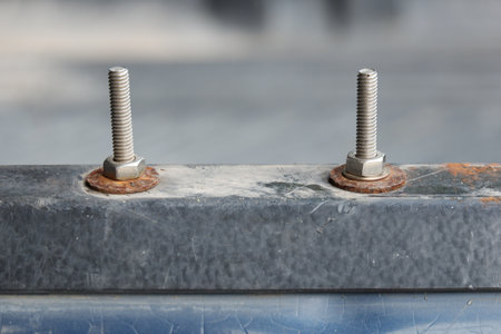 Steel nut washer with rust and stainless steel nutの写真素材