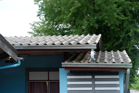 Galvanized rain gutter, drainage with pvc pipes in front of the house