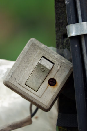 old light switch on the fence, close-up, selective focusの写真素材