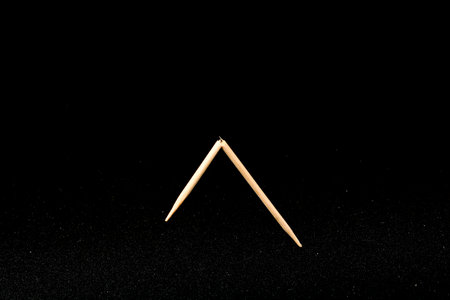Wooden Toothpick Isolated on a Black Background. Macro.