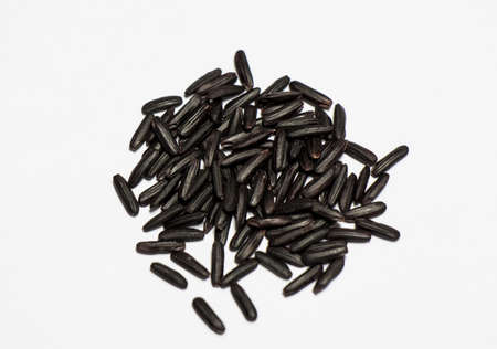 black rice on white backgroundの写真素材