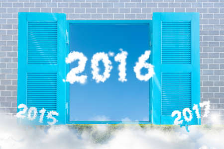 New Years 2016 in Windows Border Frame on Brick Walls, Plant Foggy Clouds conceptの写真素材