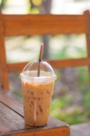 Iced tea with milk  on wood tableの写真素材
