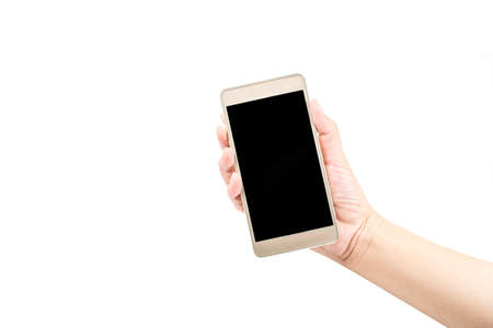 Hand  holding a gold color smart phoneの写真素材