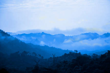 Blue mountains with foggy, blue backgroundの写真素材