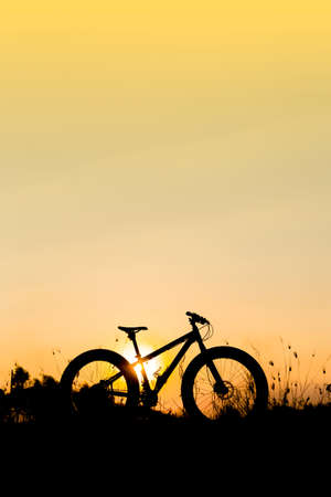 silhouette fat bike  at sunset, fat tire bike at sunsetの写真素材