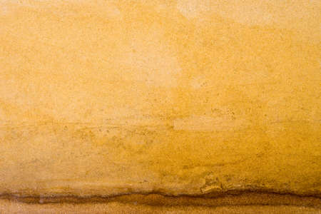 yellow of sand texture backgroundの写真素材