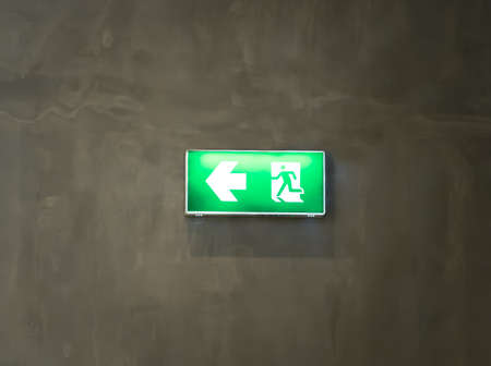 fire exit sign on gray roomの写真素材