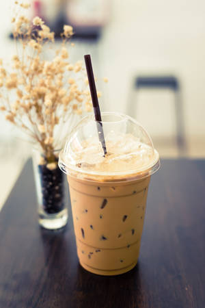 Iced coffee on wood table add retro colorの写真素材