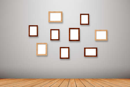 Group photo frames on the wall inside roomの写真素材
