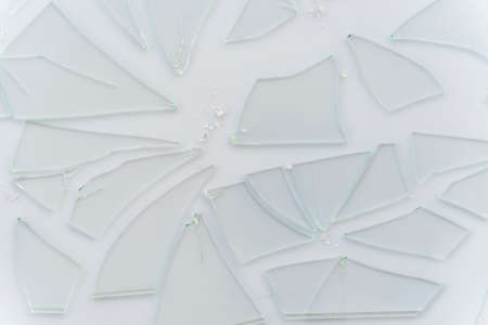 Broken glass, cracked glass on whiteの写真素材