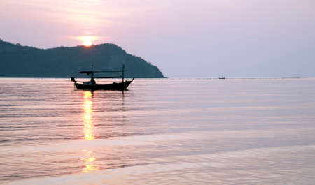 Boat on sea at sunsetの写真素材