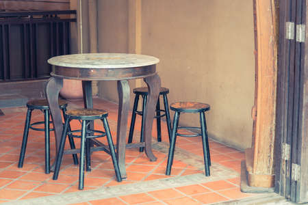 Old Wooden tables and chairs add vintage colorの写真素材