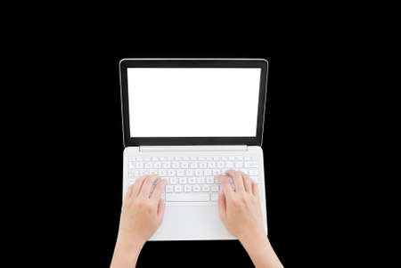 Topview of  hands using or typing on blank laptopの写真素材