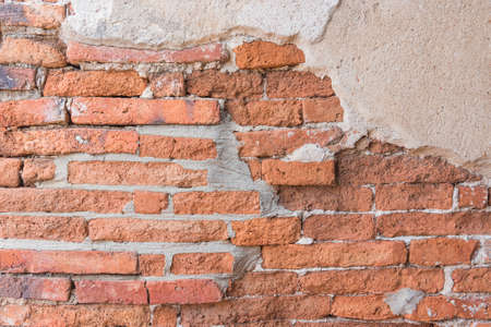 Old Orange Red Brick And Yellow Cracked Plaster Texturesの写真素材