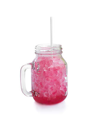 Red sweet water in glass jar with ice on white backgroundの写真素材