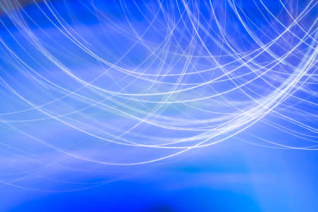 abstract blue lines of light backgroundの写真素材