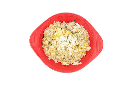 Fried rice with crabmeat on red dishの写真素材
