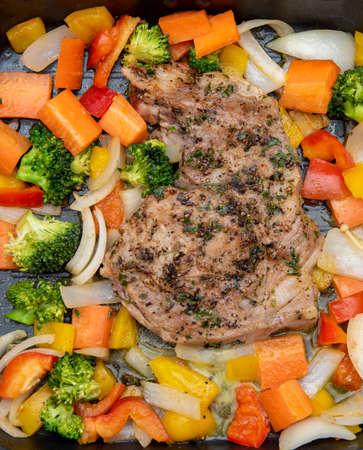 fried pork steak with colorful pepper and onion in panの写真素材